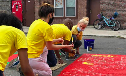 OneMamaroneck volunteers partake in the painting of a Black Lives Matter mural in the Village of Mamaroneck. 