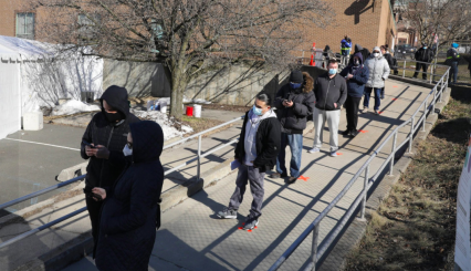 Westchester residents wait on line to receive a vaccine at Yonkers distribution site.