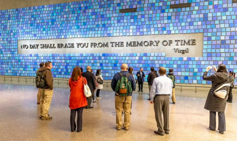 Visitors gather around an art exhibit dedicated to those who died on September 11, 2001.