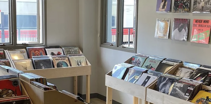 An inside view of “Underground Vinyl” featuring their diverse collection of records.