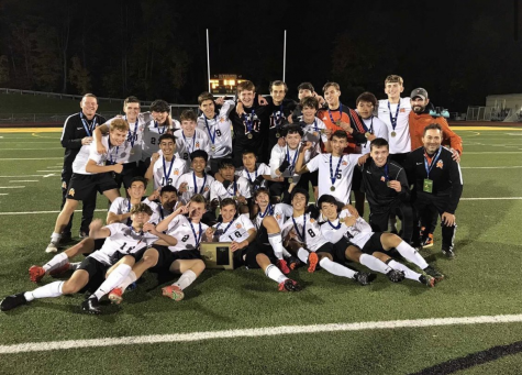 The MHS varsity soccer team is Section 1 champion.