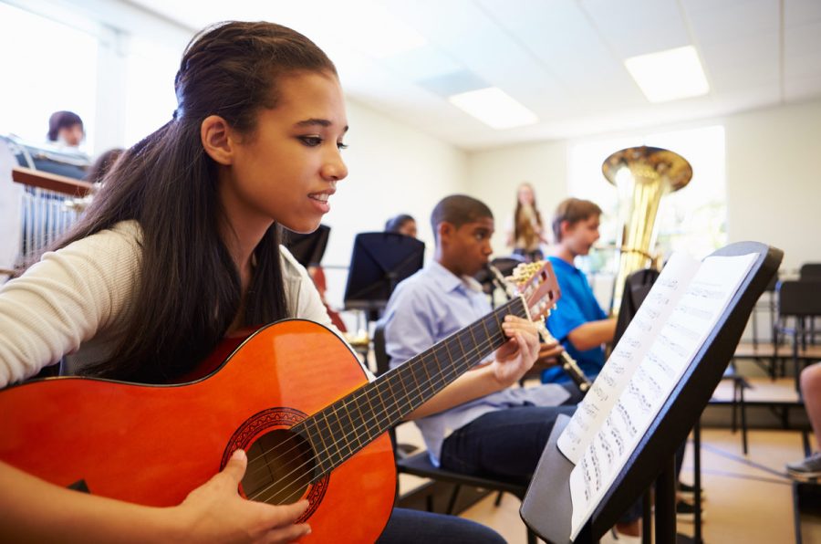 Students practice their musical instruments outside of school.