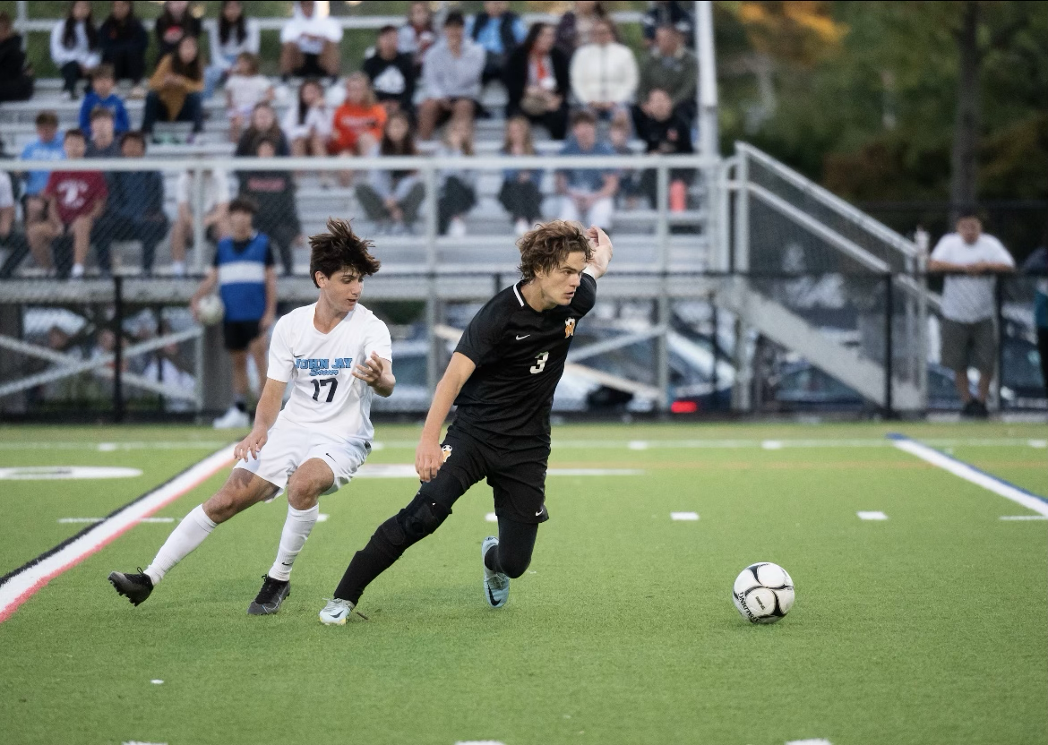 Alex Prevost excites a Memorial Field home crowd as he defends against an opponent.