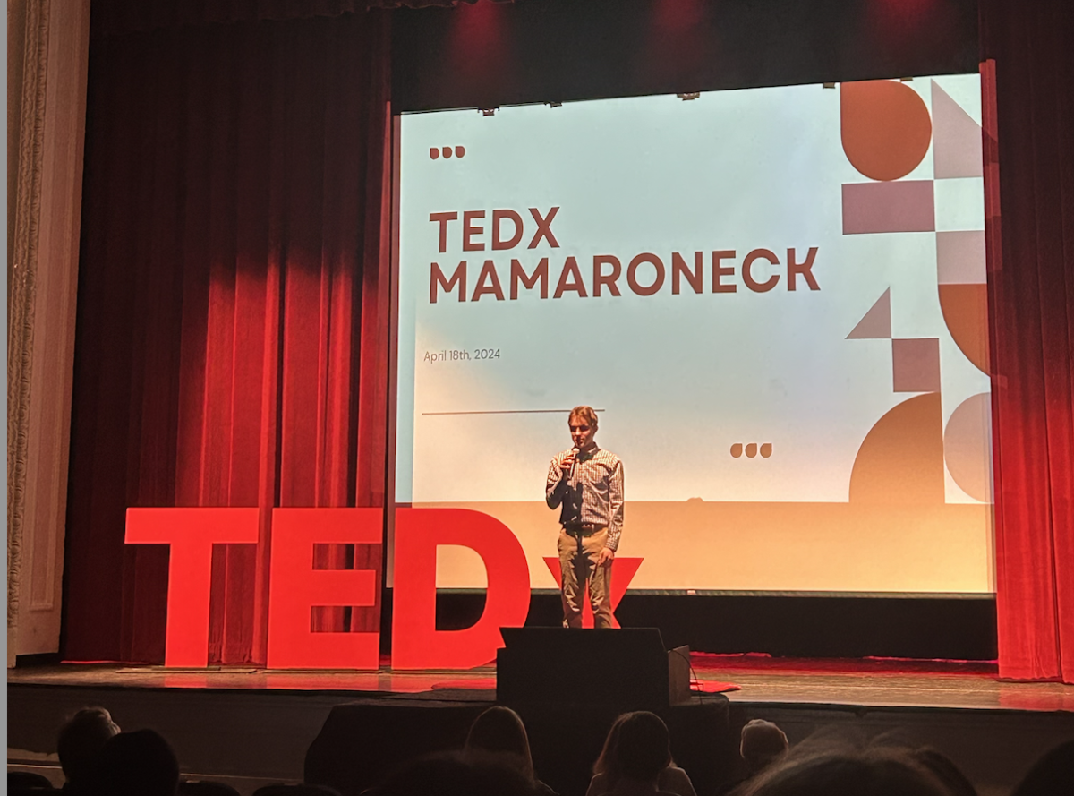 Maxwell Robinson (24) addressing the audience of TEDX in the McClain auditorium. 