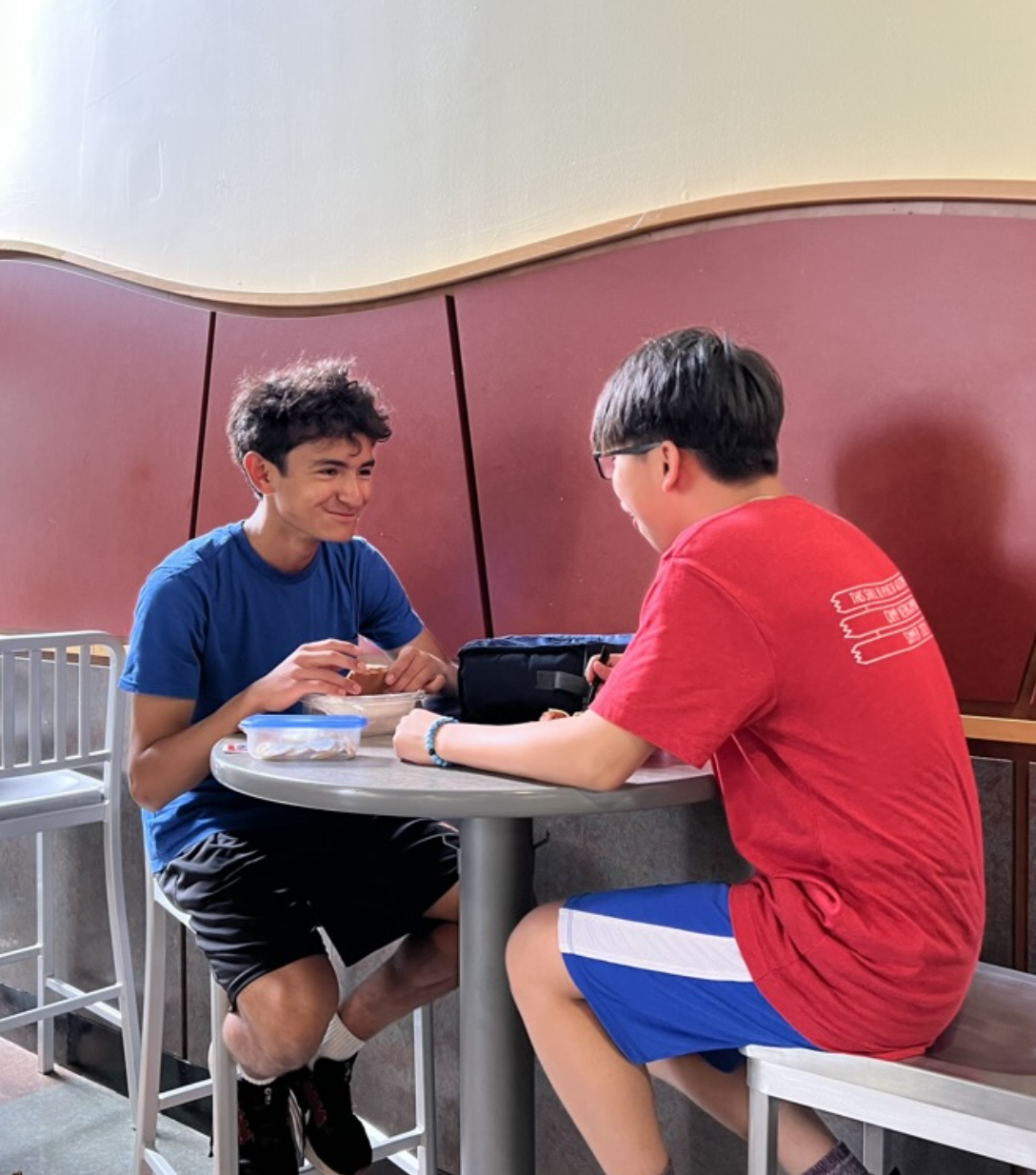 Two MHS students eating lunch in the cafeteria. 