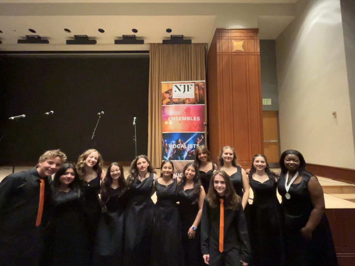 Members of the MHS Swing Choir and Jazz Band pose for a picture